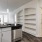 a kitchen with black counter tops